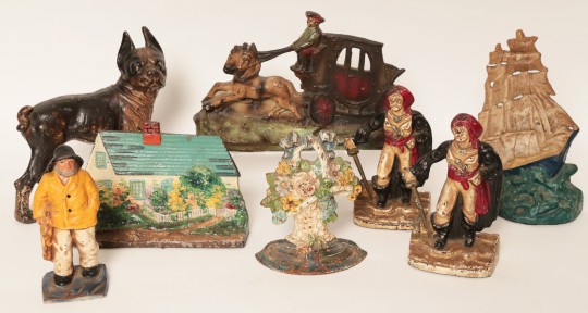 Collection of Hand Painted Cast Iron Doorstops Including a Boston Bulldog, Cottage, Fisheman, Flower Basket, Pirates, Coachmen and Horses, and Clippership