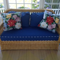 Wicker Settee with Navy Blue Upholstered Cushions