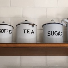 Eleven White Enamel Tin Kitchen Canisters