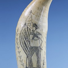 Whaler Scrimshawed Whale Tooth of Jack Tar, circa 1860, a folksy portrait of Jack Tar standing holding an American flag in one hand and a sabre in the other, the reverse with a 5-point star.