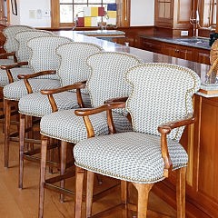 Four Walnut Upholstered Bar Height Armchairs