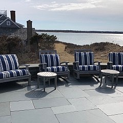 Pair of Gloster Teak Rocking Chairs and Two Gloster Teak Settees with Blue and White Cushions together with 4 Round Teak Side Tables