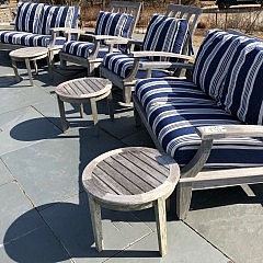 Pair of Gloster Teak Rocking Chairs, Two Gloster Teak Settees and Four Round Teak Side Tables