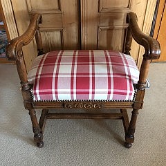 Walnut Backless Bench with Curved Arms, upholstered in red and white plaid fabric