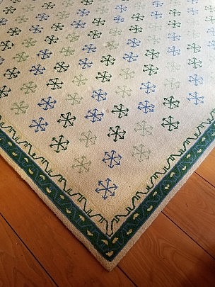 Creme Broadloom Carpet in a Green and Blue Snowflakes Pattern, Green Border