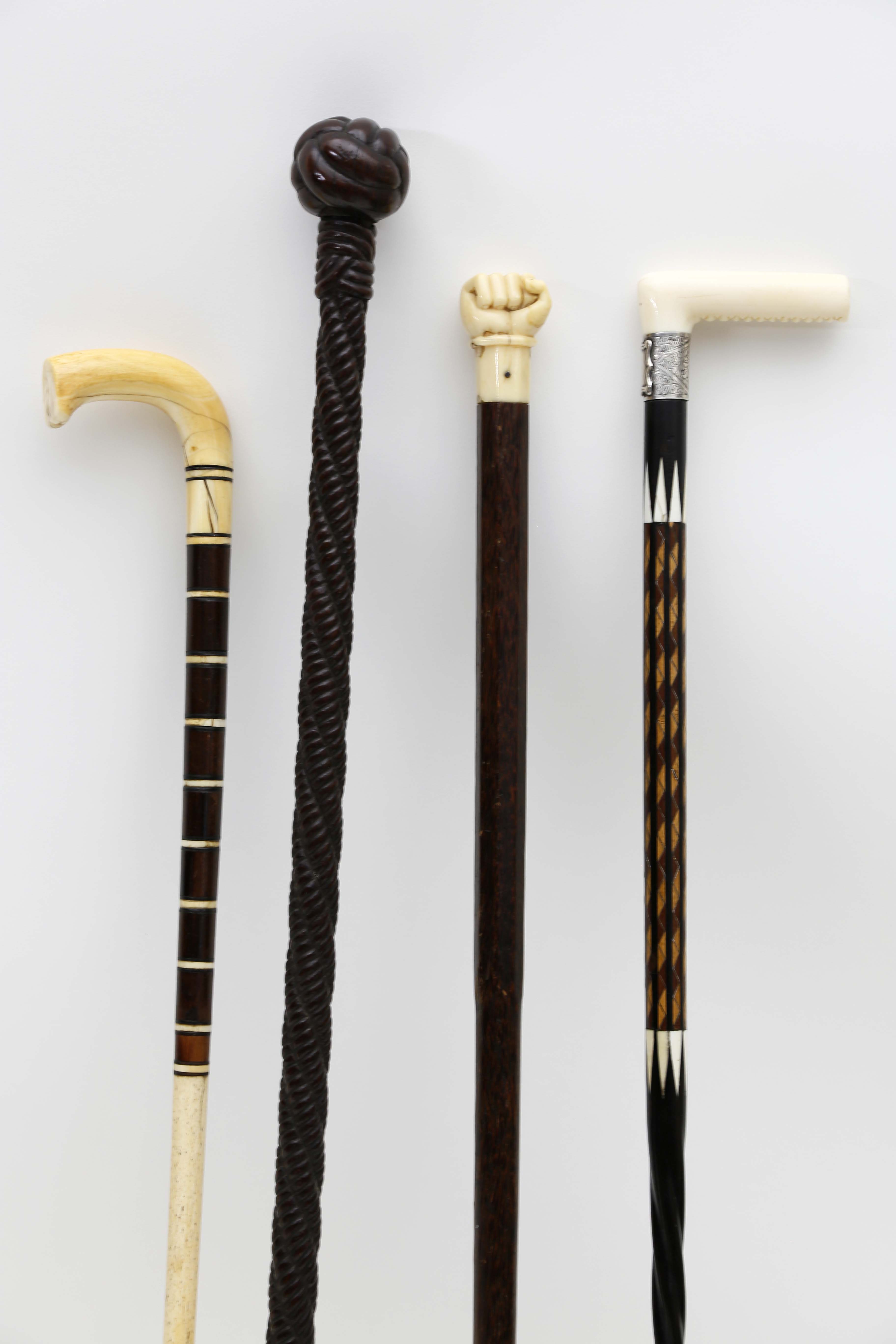Walking Sticks Group of Four Whaler Carved Walking Sticks and Canes