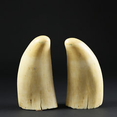 Pair of Whaler Scrimshawed and Polychromed Sperm Whale Teeth, circa 1860