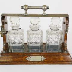 English Oak and Crystal Three-Bottle Tantalus, 19th Century