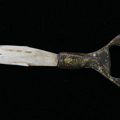 Antique Whalebone and Patina Bronze Bottle Opener