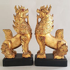 Pair of Carved and Gilt Tibetan Foo Dogs