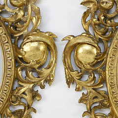 Pair of American Carved Giltwood Oval Mirrors, 19th Century