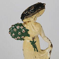 Vintage Painted Cast Iron Doorstop of Lady Holding a Bouquet