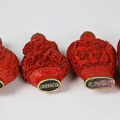 Four Vintage Chinese Carved Cinnabar Snuff Bottles