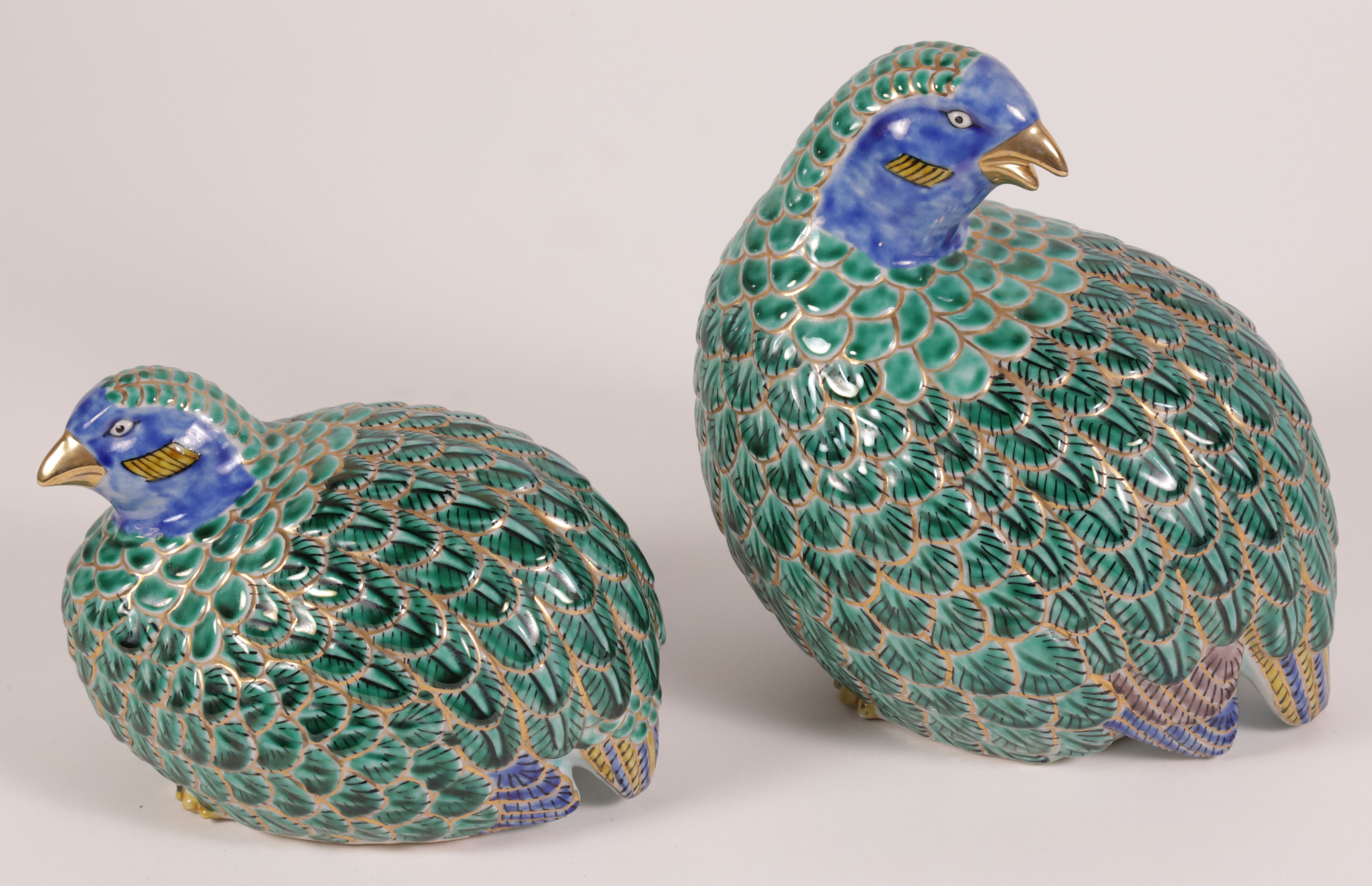 Pair of Japanese Polychromed Glazed and Gilt Porcelain Models