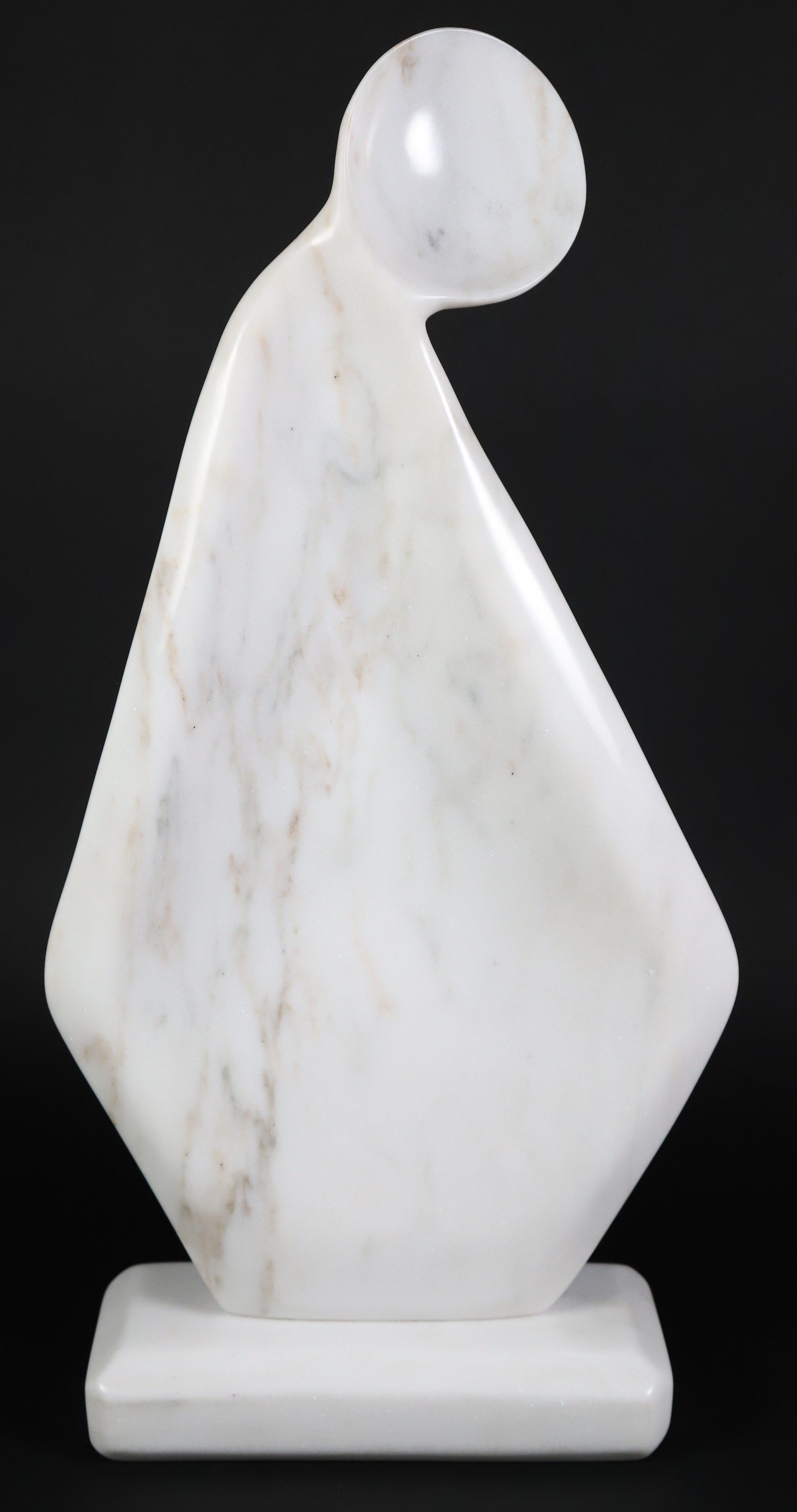 White Marble Sculpture Of A Woman's Silhouette