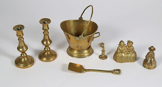 Group Of Brass Goods: Candle Sticks, Two Figural Dinner Bells, Trivet, Kindling Match Bucket, Shovel 