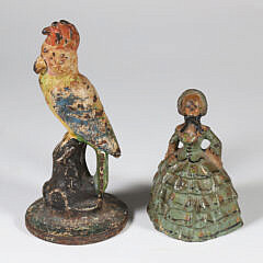 Two Cast Iron Doorstops, A Parrot and A Lady
