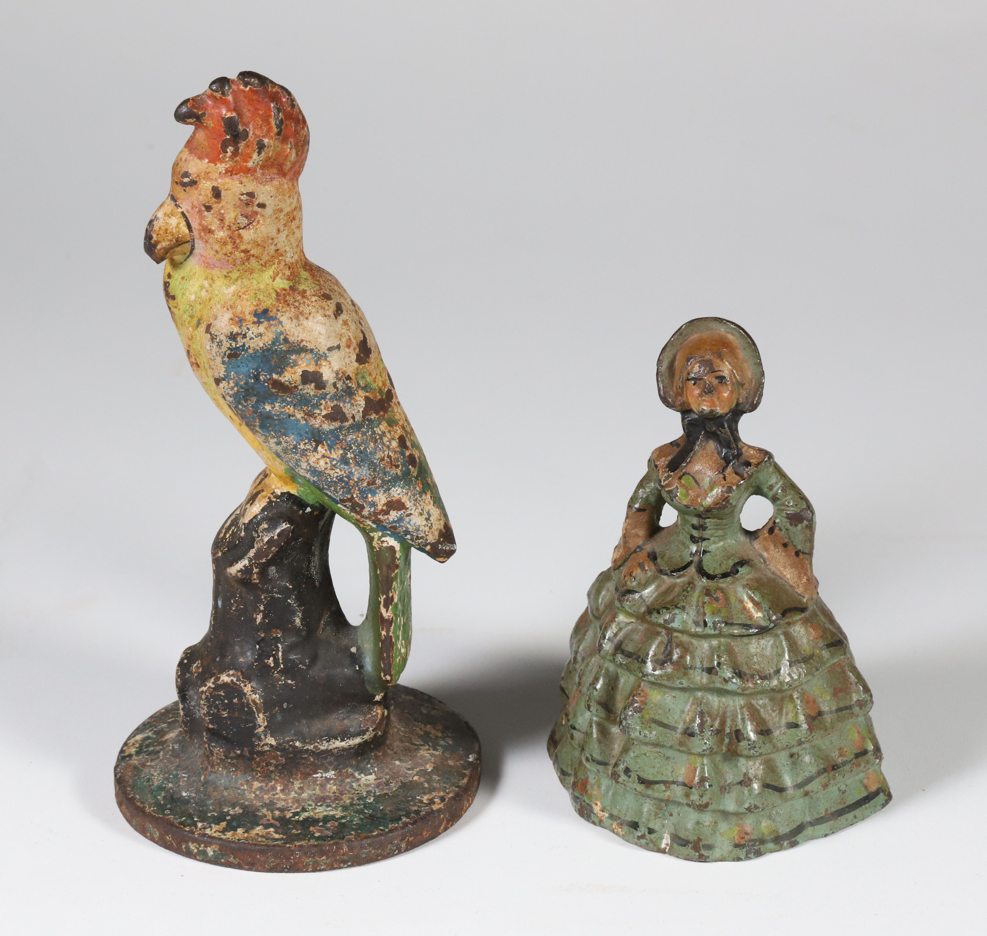 Two Cast Iron Doorstops, A Parrot and A Lady
