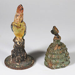 Two Antique Polychrome Cast Iron Doorstops, a Parrot and a Lady