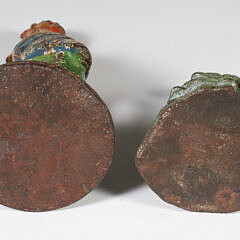 Two Antique Polychrome Cast Iron Doorstops, a Parrot and a Lady