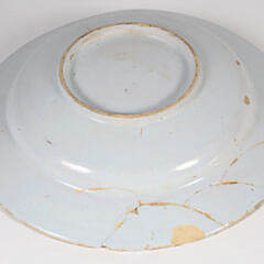 A Delft Blue and White Plate and Yellow Ground Delft Shallow Bowl, circa 1730