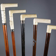 Group of Five L-Grip Canes with Antique Whale Ivory Grips