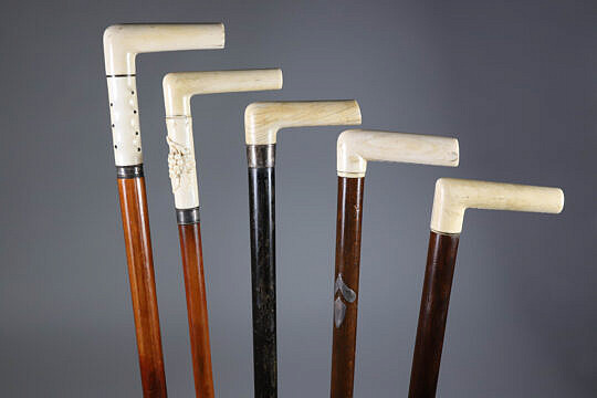 Group of Five L-Grip Canes with Antique Whale Ivory Grips