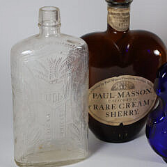 Nine Antique Bottles in Various Forms and Colors