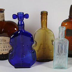 Nine Antique Bottles in Various Forms and Colors