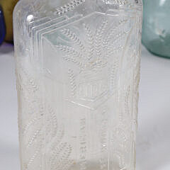 Nine Antique Bottles in Various Forms and Colors