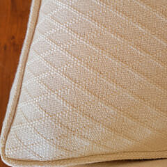 Designer Creme Upholstered Single Cushion Skirted Settee with Rolled Arms
