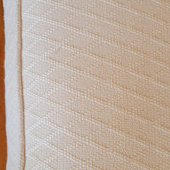 Designer Creme Upholstered Single Cushion Skirted Settee with Rolled Arms