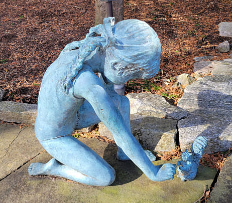 Bronze Sculpture of a Girl Feeding a Squirrel