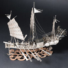 Antique Chinese Silver Model of War Junk on Carved Ocean Wave Base