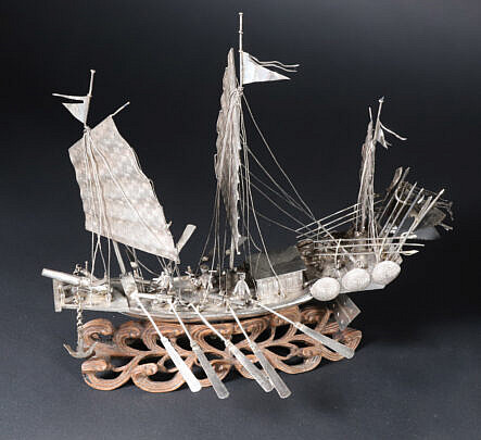 Antique Chinese Silver Model of War Junk on Carved Ocean Wave Base
