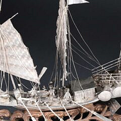 Antique Chinese Silver Model of a War Junk on Carved Teak Wood Ocean Wave Base