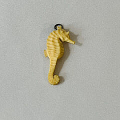Signed Charlie Sayle Sr. Carved Sperm Whale Pin and Seahorse Pendant, circa 1952