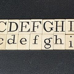Two Complete Sets of Antique Whalebone Alphabet Tiles, 19th century