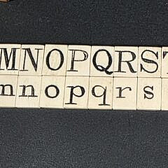 Two Complete Sets of Antique Whalebone Alphabet Tiles, 19th century