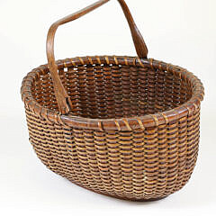 Antique Oval Swing Handle Nantucket Basket In Old Dark Surface