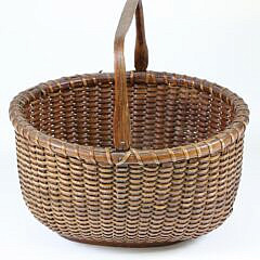 Antique Oval Swing Handle Nantucket Basket In Old Dark Surface
