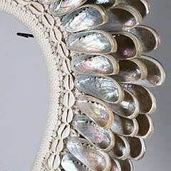 Bali Seashell Ornament Bib on Custom Stand