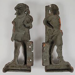 Two Antique Paint Decorated Cast Iron Soldier Architectural Brackets