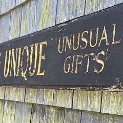 Vintage Carved and Painted Something Unique Quarterboard Trade Sign, 20th century
