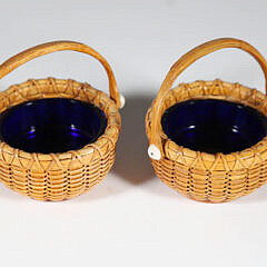 Pair of Paul Willer Nantucket Basket Woven Open Salts with Swing Handles and Cobalt Glass Liners