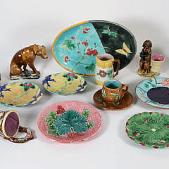 Group of Antique Majolica Ceramics, including oval platter, wall pocket, two small pitchers, two dogs, five assorted small dishes, cup, and saucer monkey head
