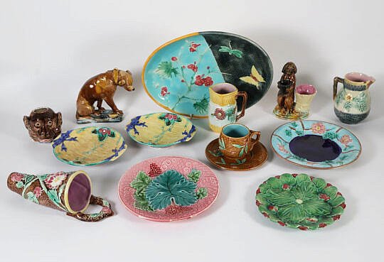 Group of Antique Majolica Ceramics, including oval platter, wall pocket, two small pitchers, two dogs, five assorted small dishes, cup, and saucer monkey head
