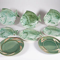 Six Ceramic Folk Art Fish Form Luncheon Plates and Two Round Serving Dishes