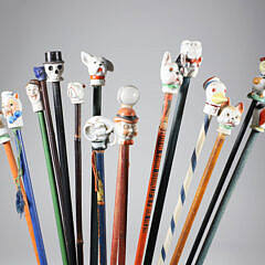 Collection of 16 Assorted Porcelain and Wood Carnival Walking Sticks 