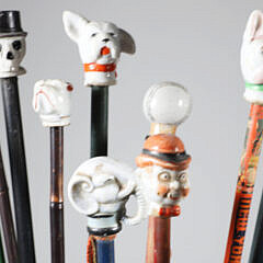 Collection of 16 Assorted Porcelain and Wood Carnival Walking Sticks